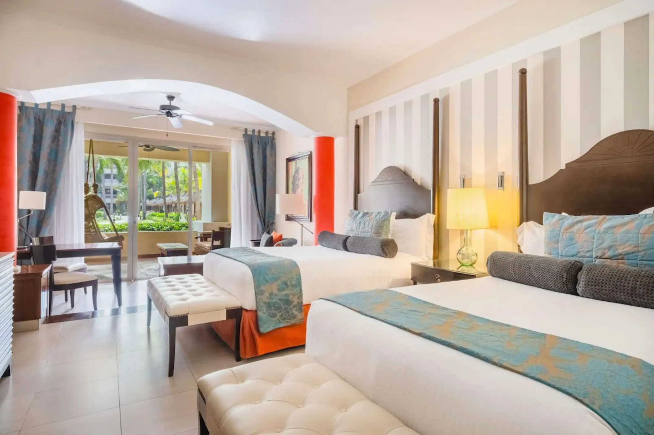 Guest room with two double beds and garden view balcony at JOIA Rose Hall by Iberostar, Montego Bay