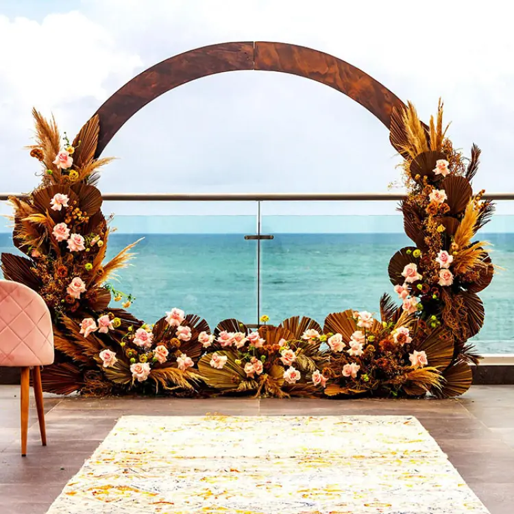 Floral circular arch for a sky wedding ceremony at Margaritaville Island Reserve Riviera Maya
