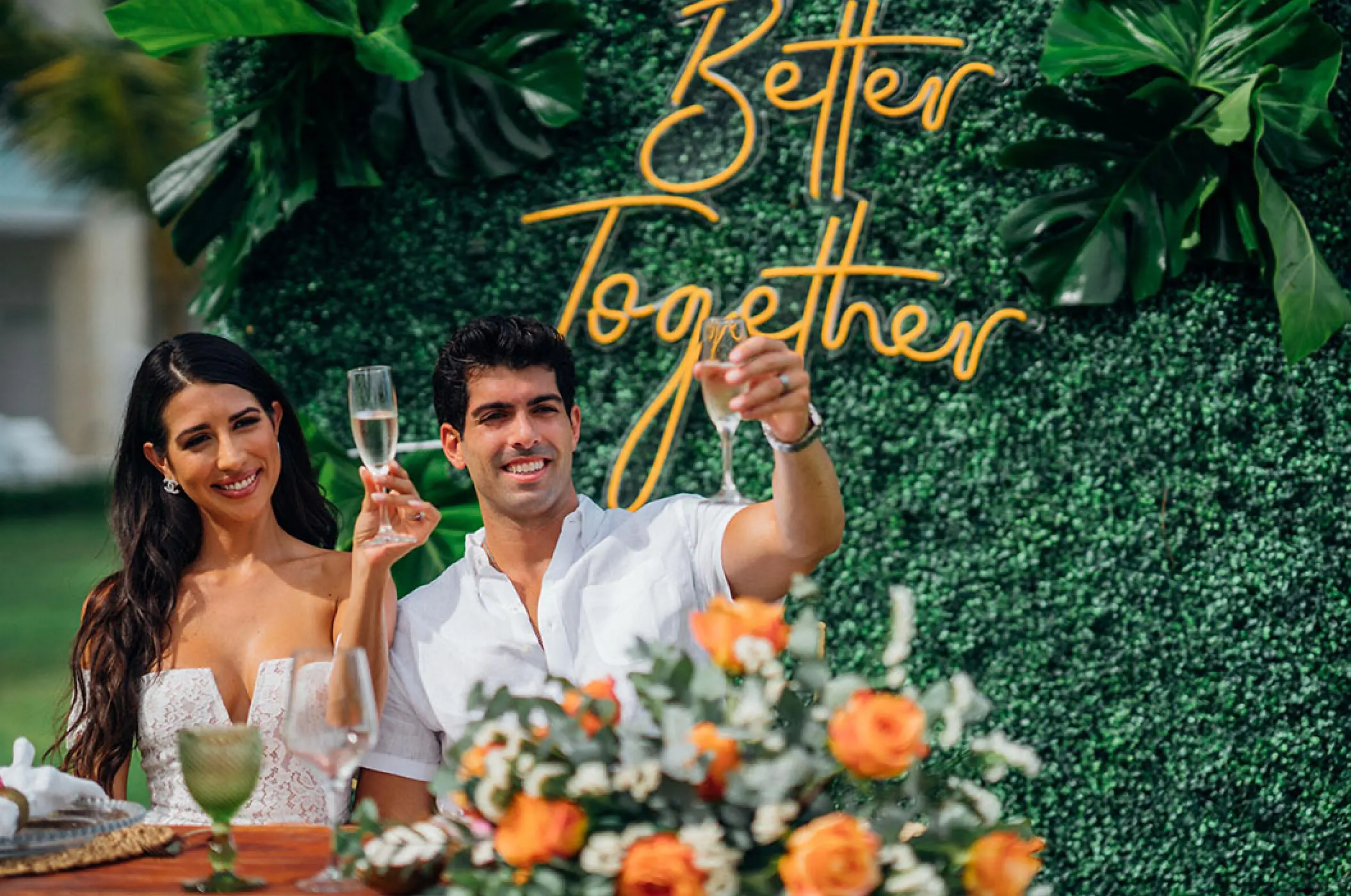 The bride and groom raising a toast at Margaritaville Island Reserve Cap Cana, Punta Cana