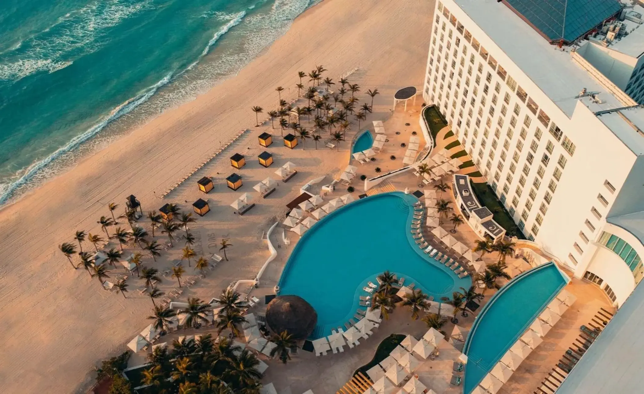 Aerial view of Le Blanc Spa Resort pools and beachfront, Cancun