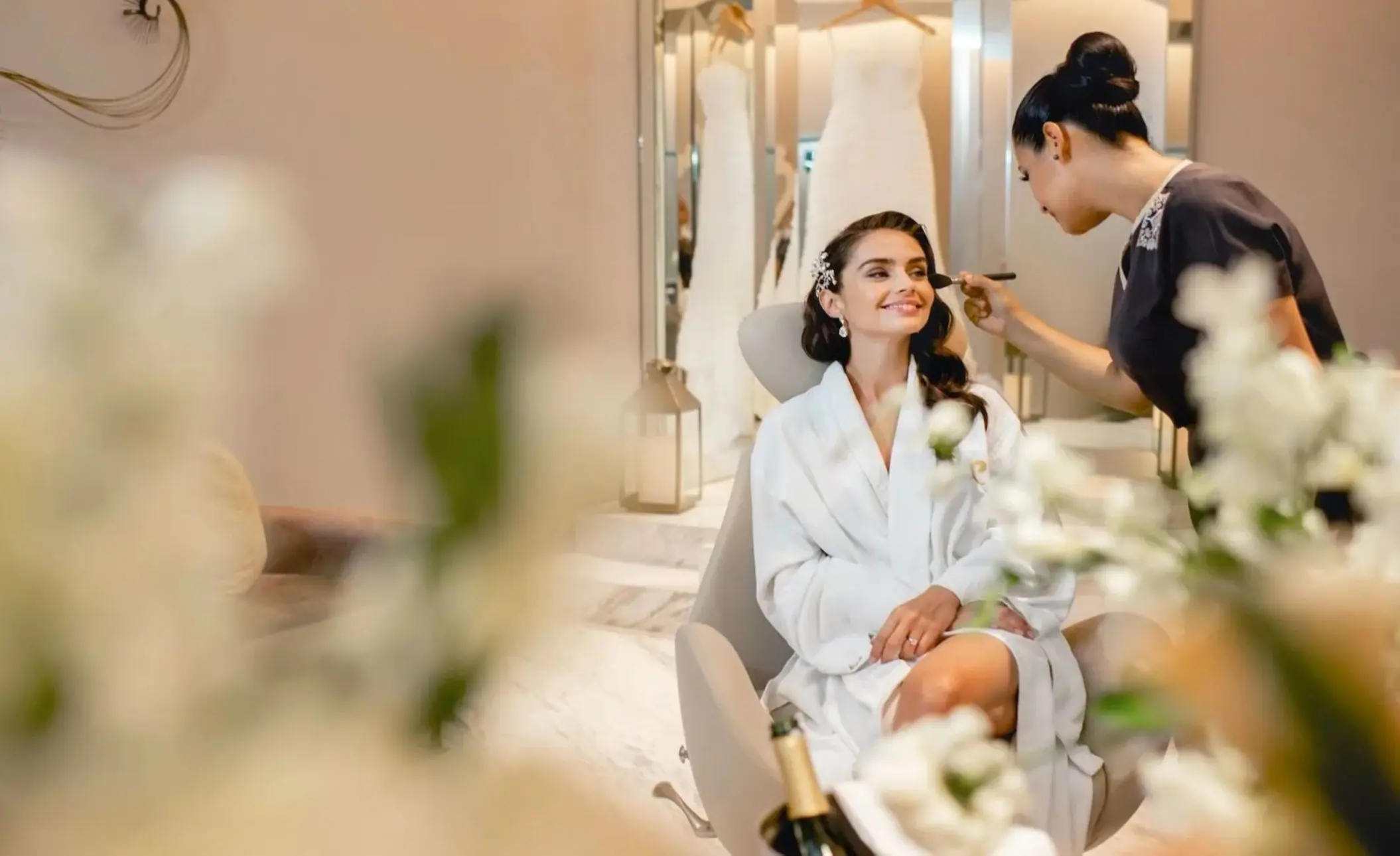 Bride getting makeup done in the bridal suite at Le Blanc Spa Resort, Cancun