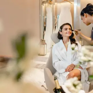 Bride getting makeup done in the bridal suite at Le Blanc Spa Resort, Cancun