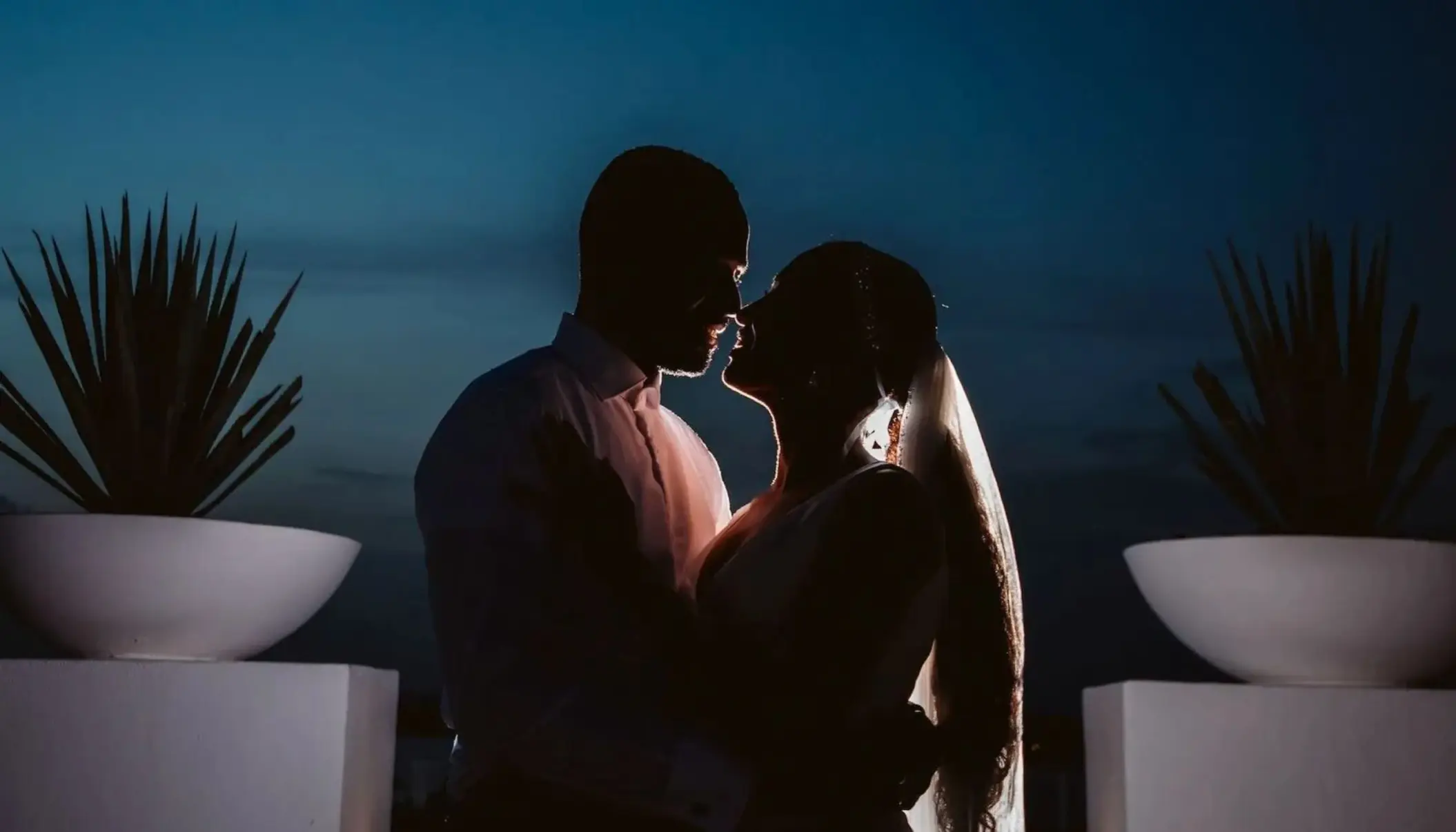 Silhouette of a bride and groom at night at Le Blanc Spa Resort, Cancun