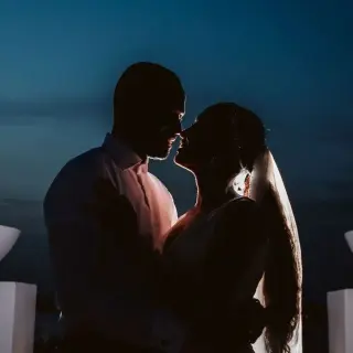 Silhouette of a bride and groom at night at Le Blanc Spa Resort, Cancun