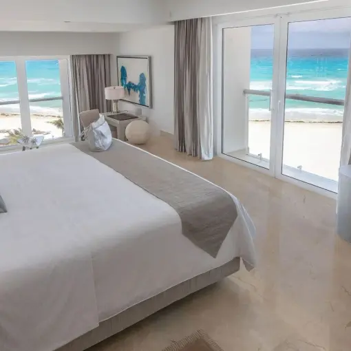 Junior Suite with ocean views and white linens at Le Blanc Spa Cancun