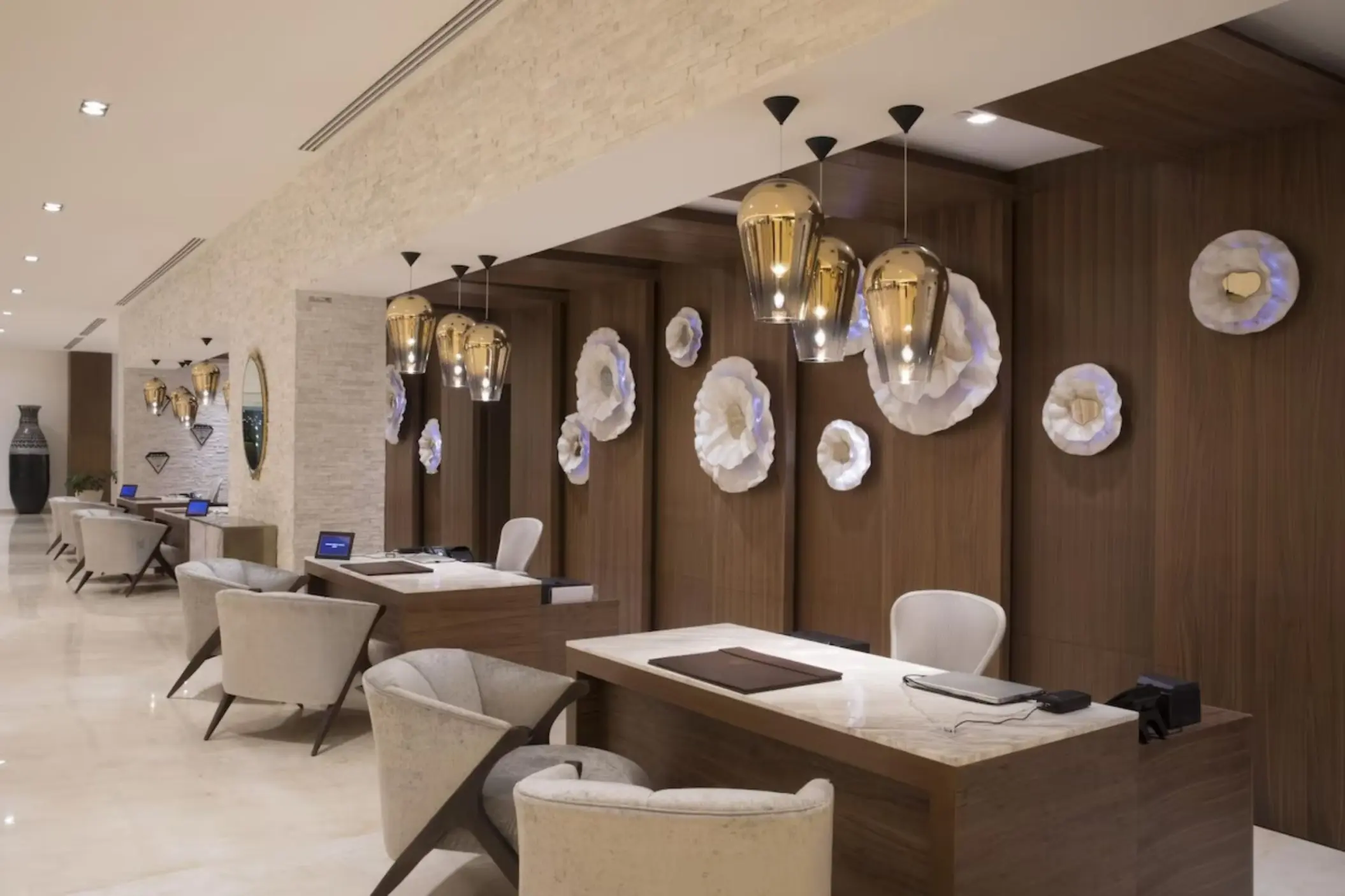 Modern lobby check-in desks at Le Blanc Spa Resort, Cancun