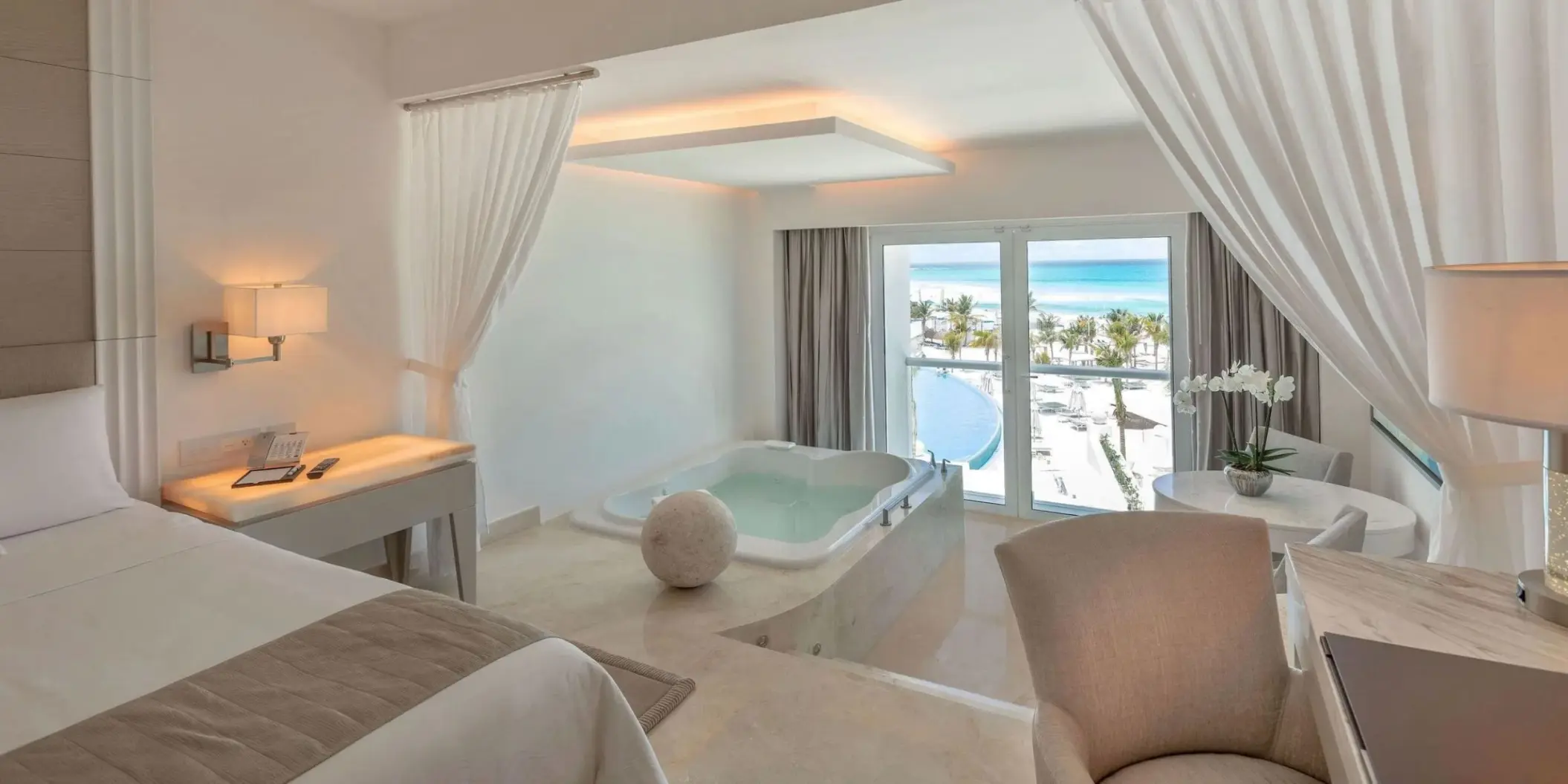 Royal Honeymoon Suite with indoor whirlpool tub and ocean view balcony at Le Blanc Cancun