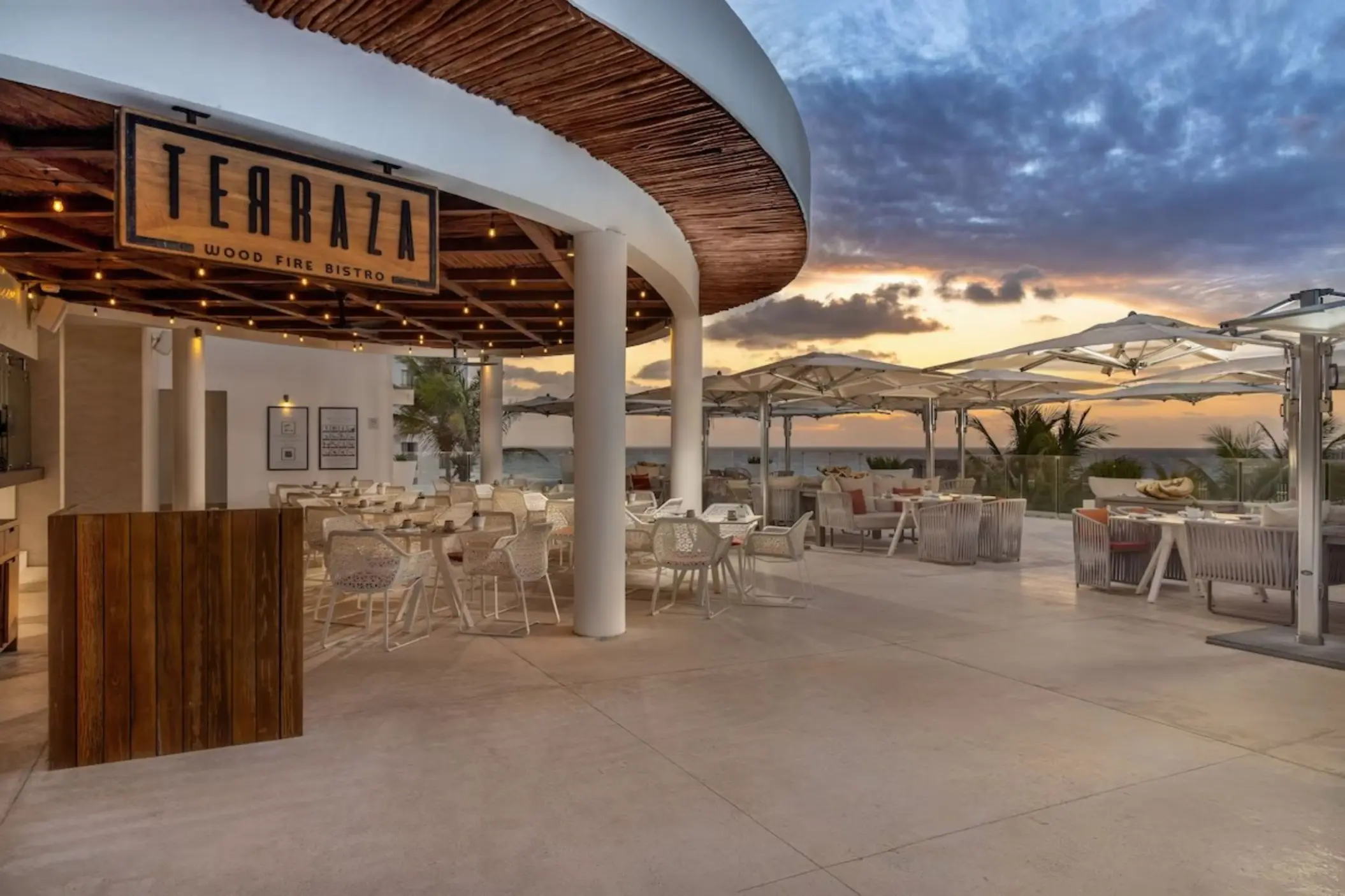 Terraza Wood Fire Bistro outdoor seating at sunset, Le Blanc Cancun