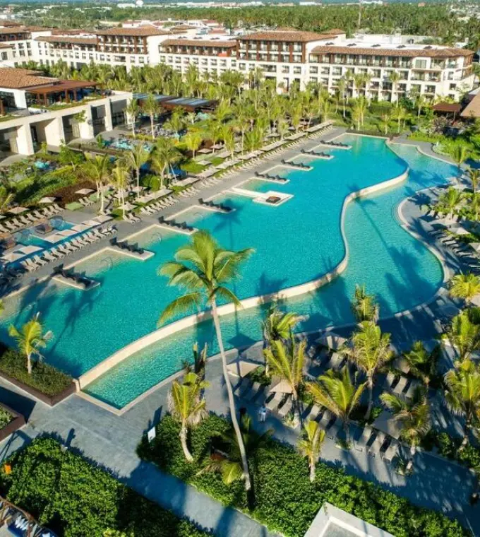 Aerial view of large winding pools and resort grounds at Lopesan Costa Bavaro, Punta Cana