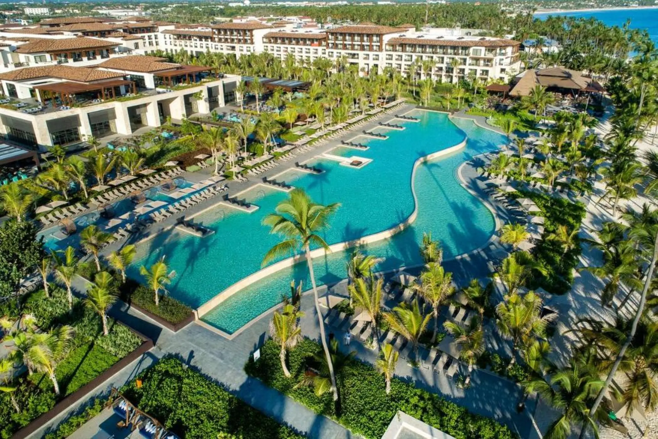 Aerial view of large winding pools and resort grounds at Lopesan Costa Bavaro, Punta Cana