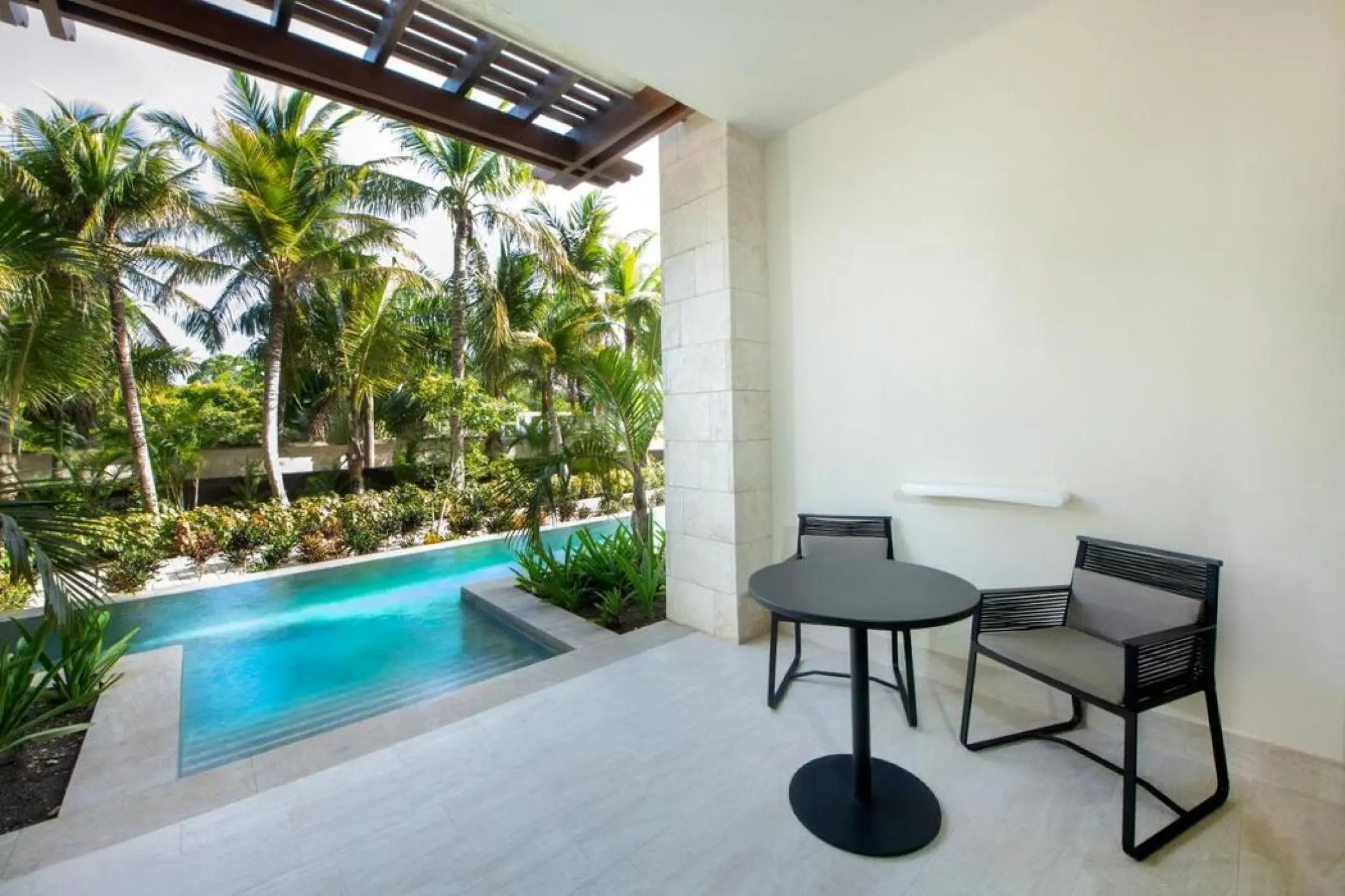 Swim-out suite terrace with a private pool and seating at Lopesan Costa Bavaro, Punta Cana