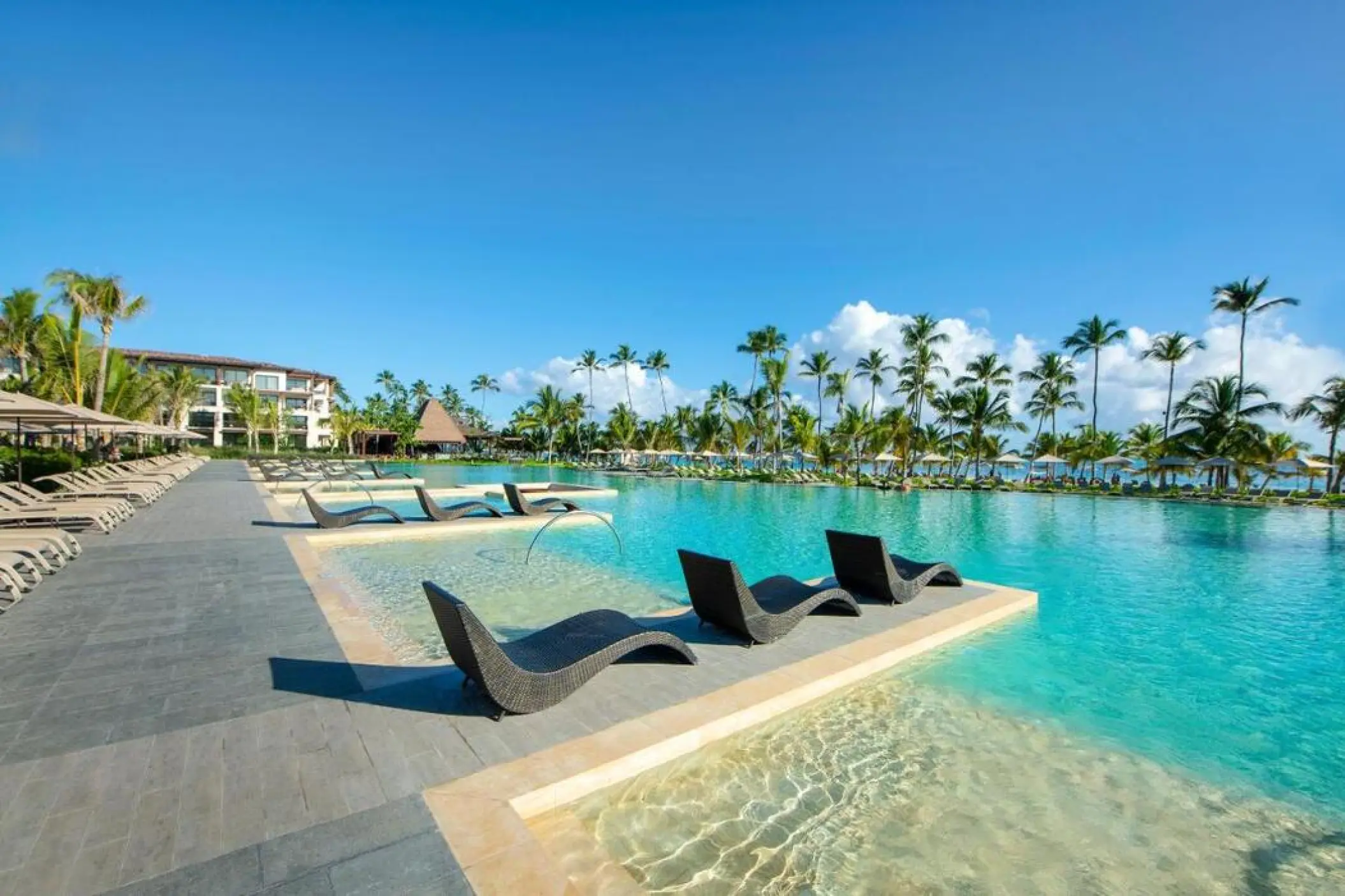 In-pool lounge chairs and infinity pool at Lopesan Costa Bavaro, Punta Cana