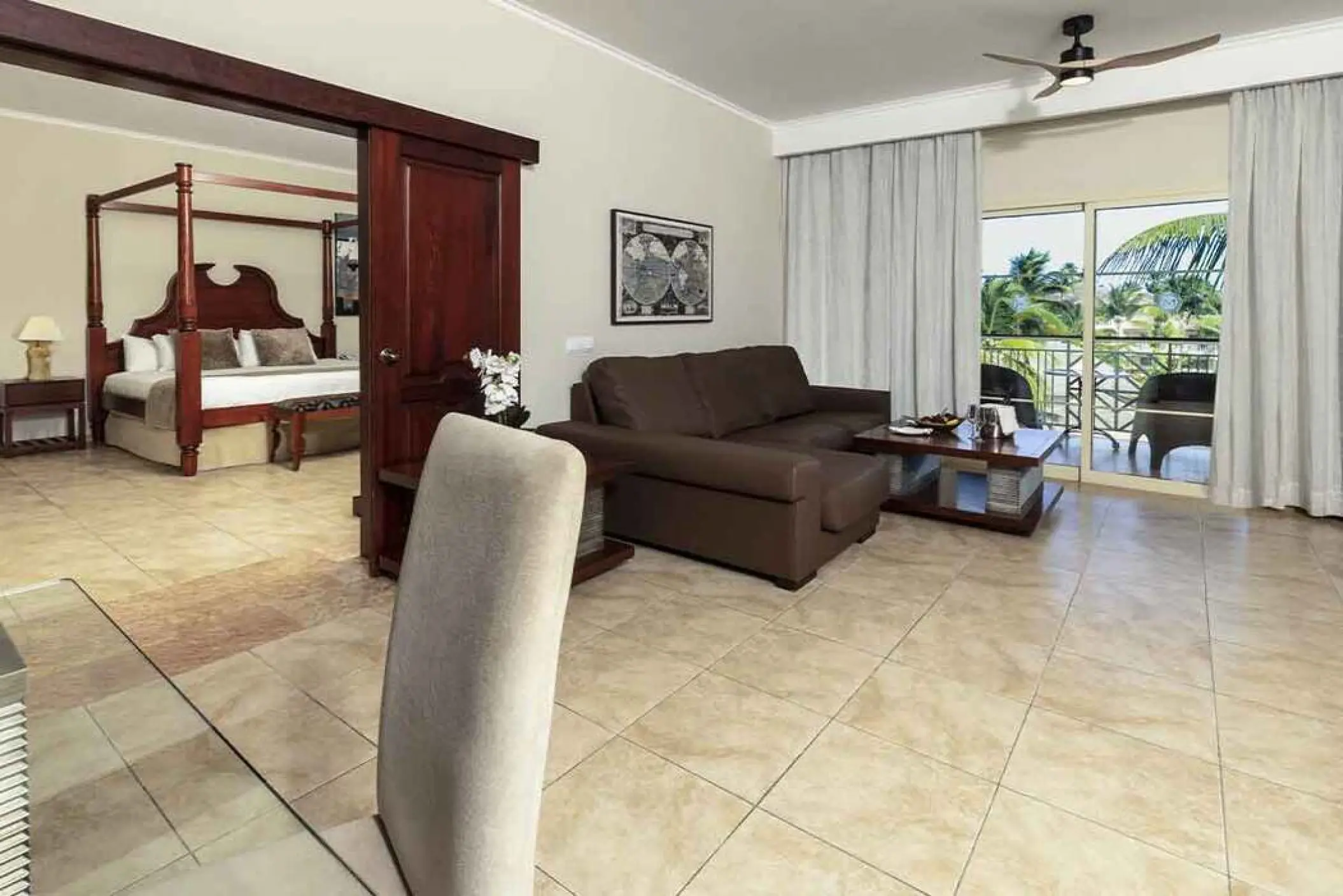 One bedroom suite with private balcony and canopy bed at Majestic Colonial, Punta Cana