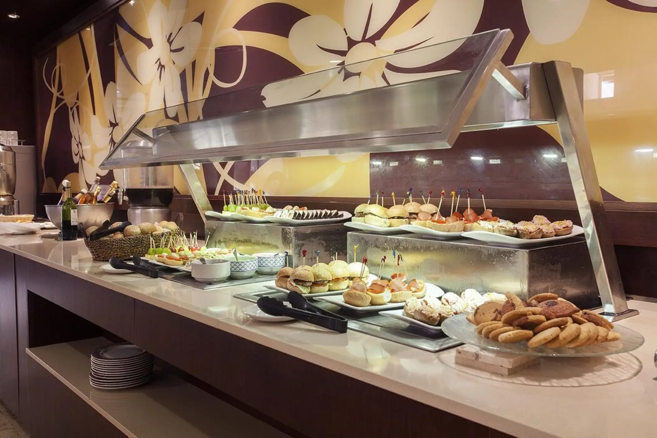 Buffet station with sliders and appetizers at Majestic Colonial, Punta Cana