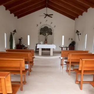 Chapel wedding ceremony venue with wooden pews at Majestic Colonial, Punta Cana