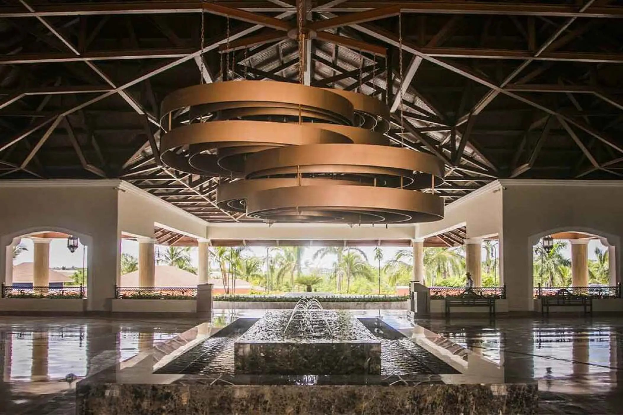Majestic Colonial Punta Cana lobby with a tiered gold chandelier and water fountain, Punta Cana
