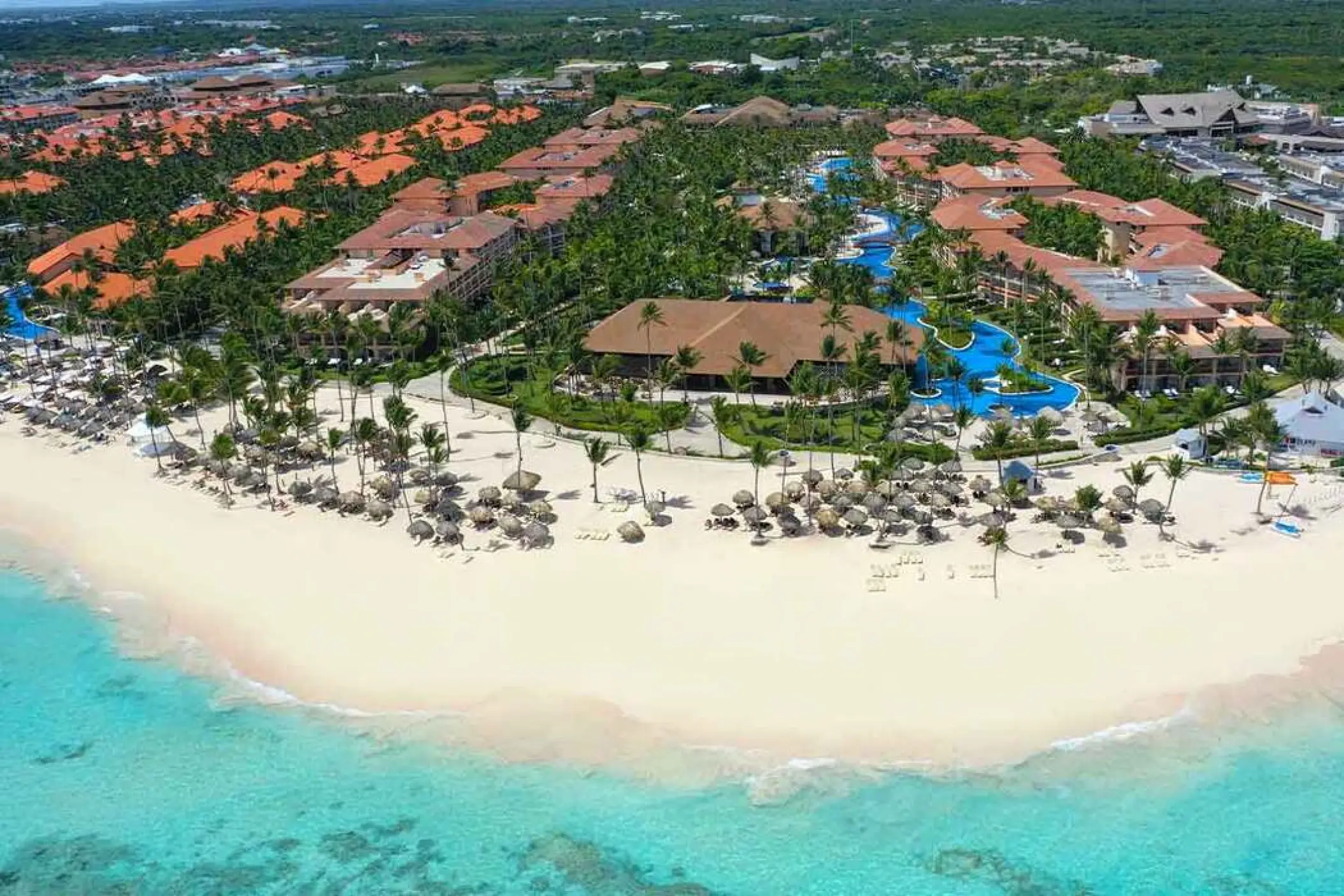 Aerial view of the white sand beach and pools at Majestic Colonial, Punta Cana