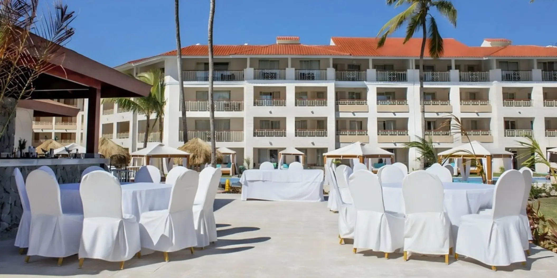 Outdoor wedding reception setup at Parrots Bar at Majestic Colonial, Punta Cana