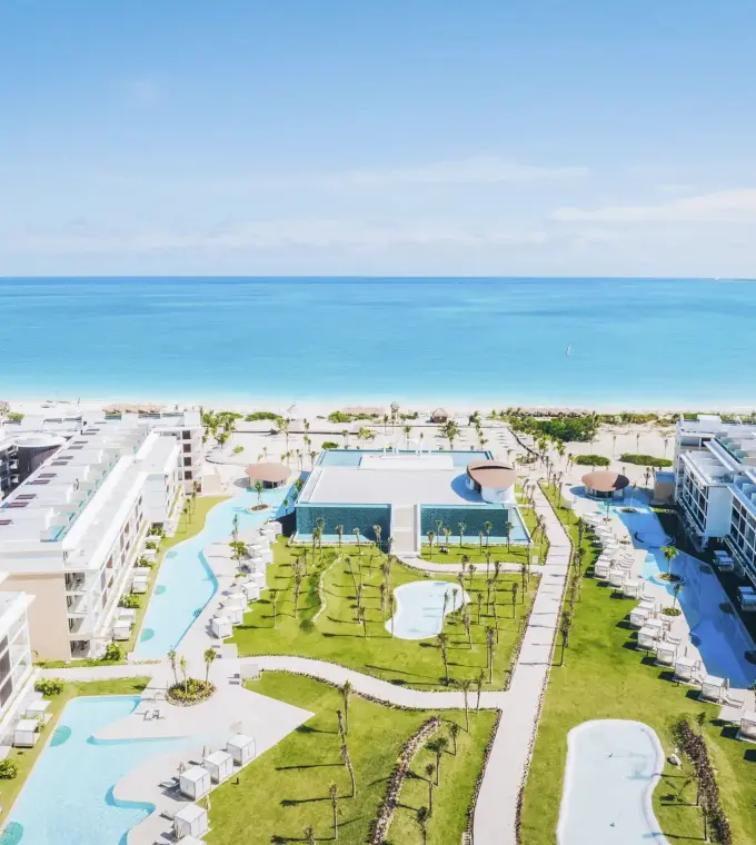 Aerial view of Majestic Mirage Costa Mujeres buildings and pools leading to the Caribbean sea, Cancun