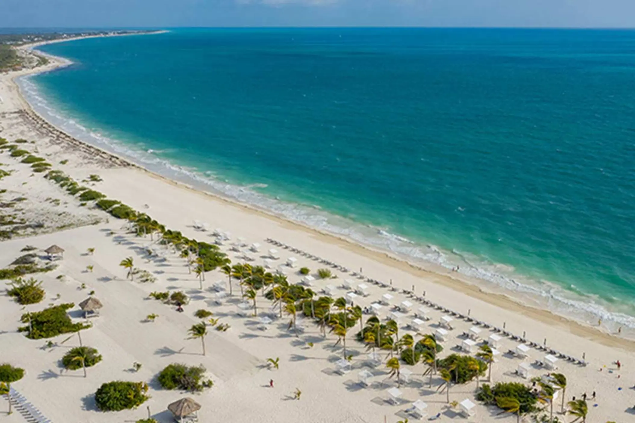 Aerial view of the white sand beach and turquoise water at Majestic Mirage Costa Mujeres, Cancun