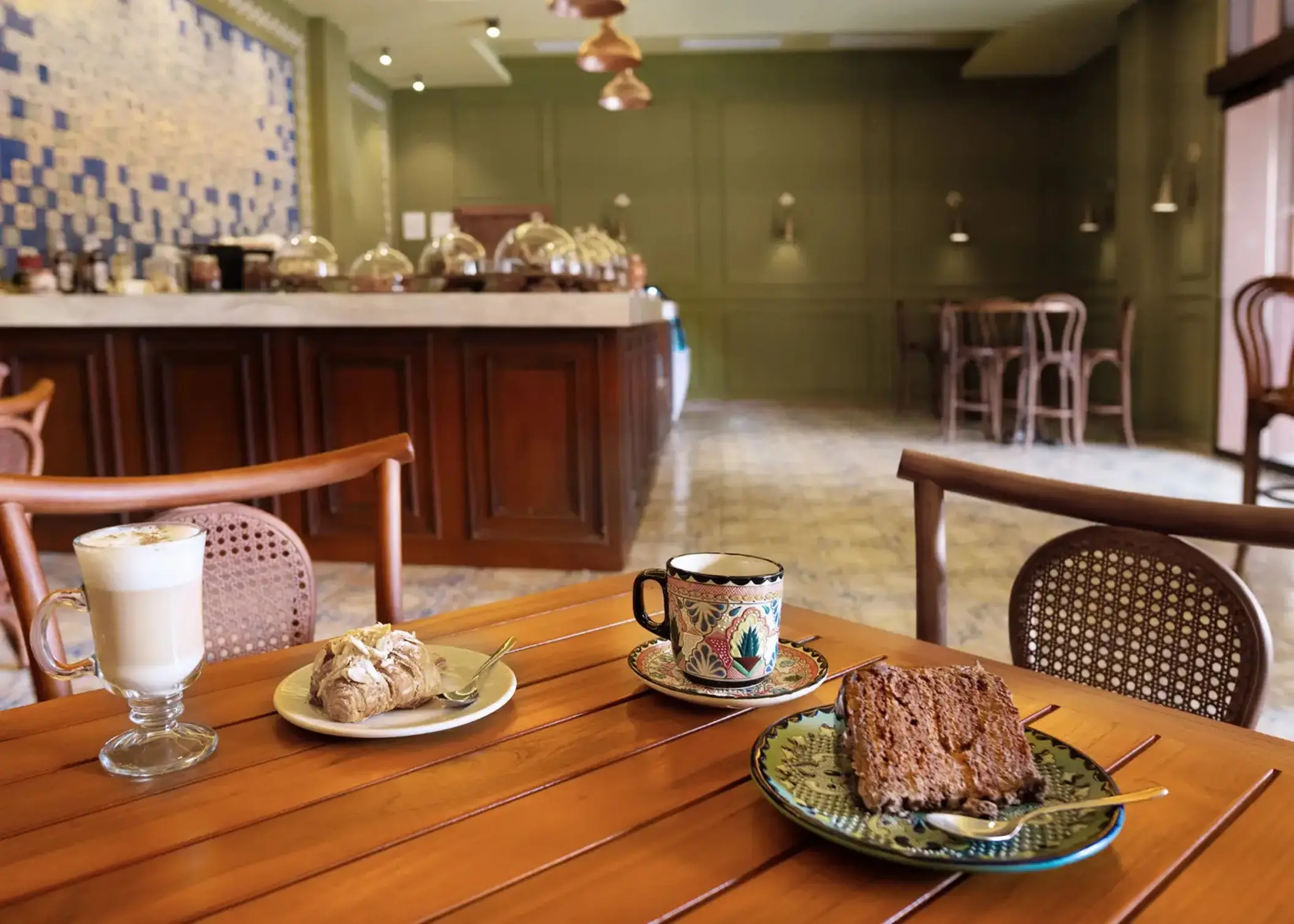 Coffee and pastries on a wooden table at the cafe in Majestic Mirage, Cancun