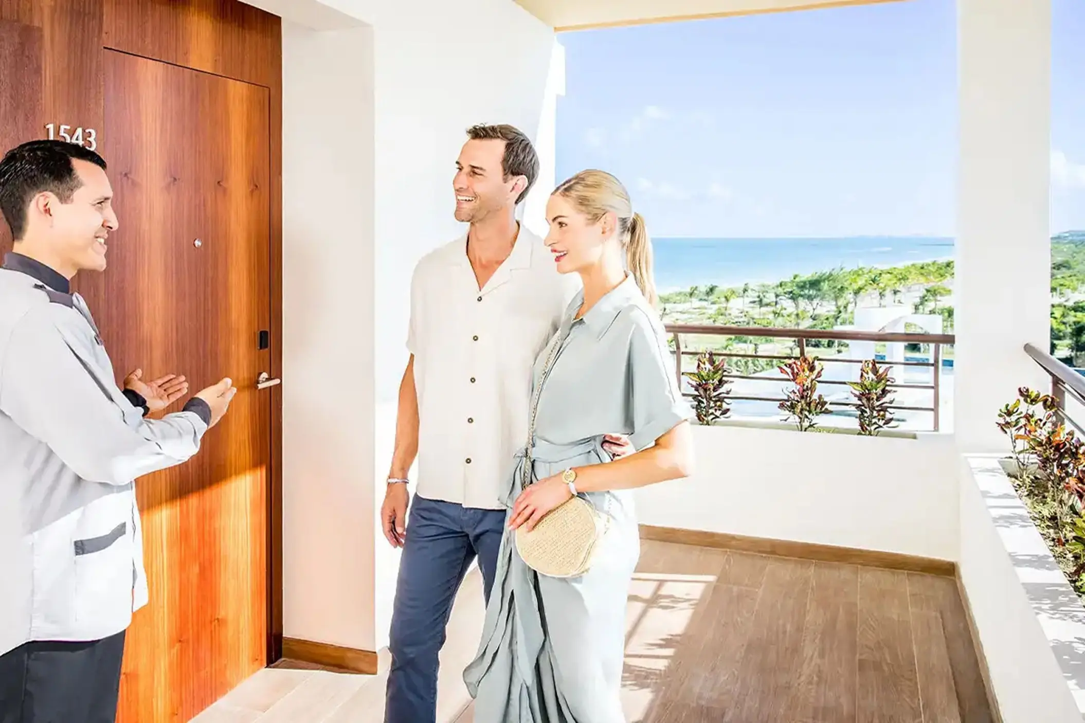 Butler welcoming a couple to their suite at Majestic Mirage Costa Mujeres, Cancun