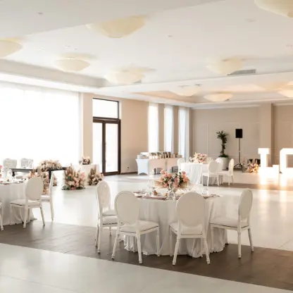 Wedding reception with white tables and illuminated LOVE letters at Majestic Mirage Costa Mujeres, Cancun