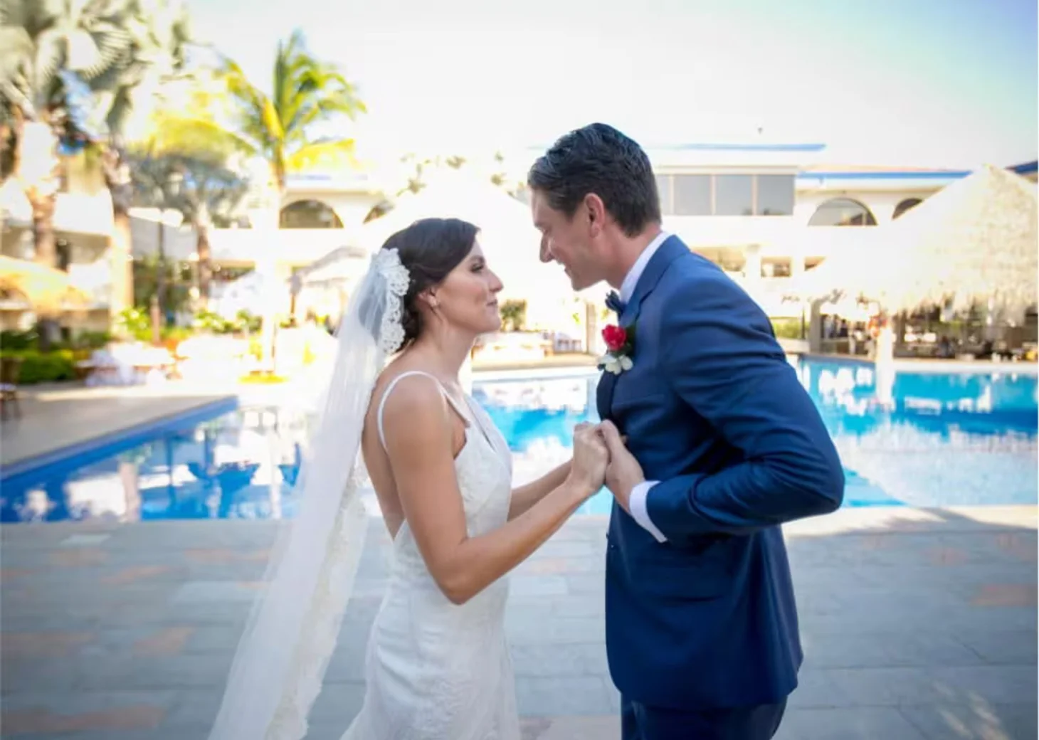 bride and groom by the pool at Margaritaville Beach Resort Playa Flamingo