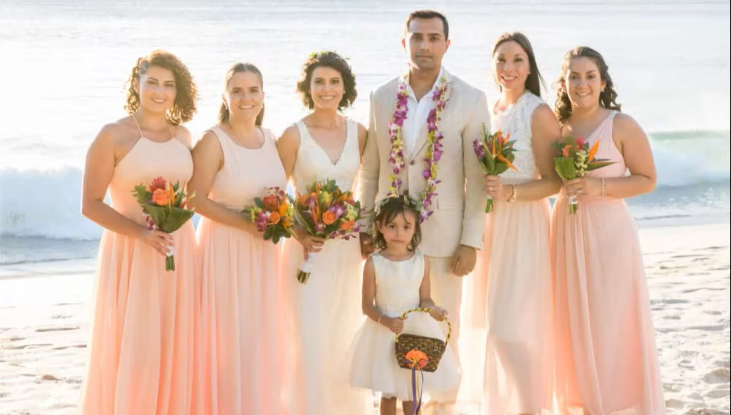 bride groom and bridesmaids and flower girl at Margaritaville Beach Resort Playa Flamingo