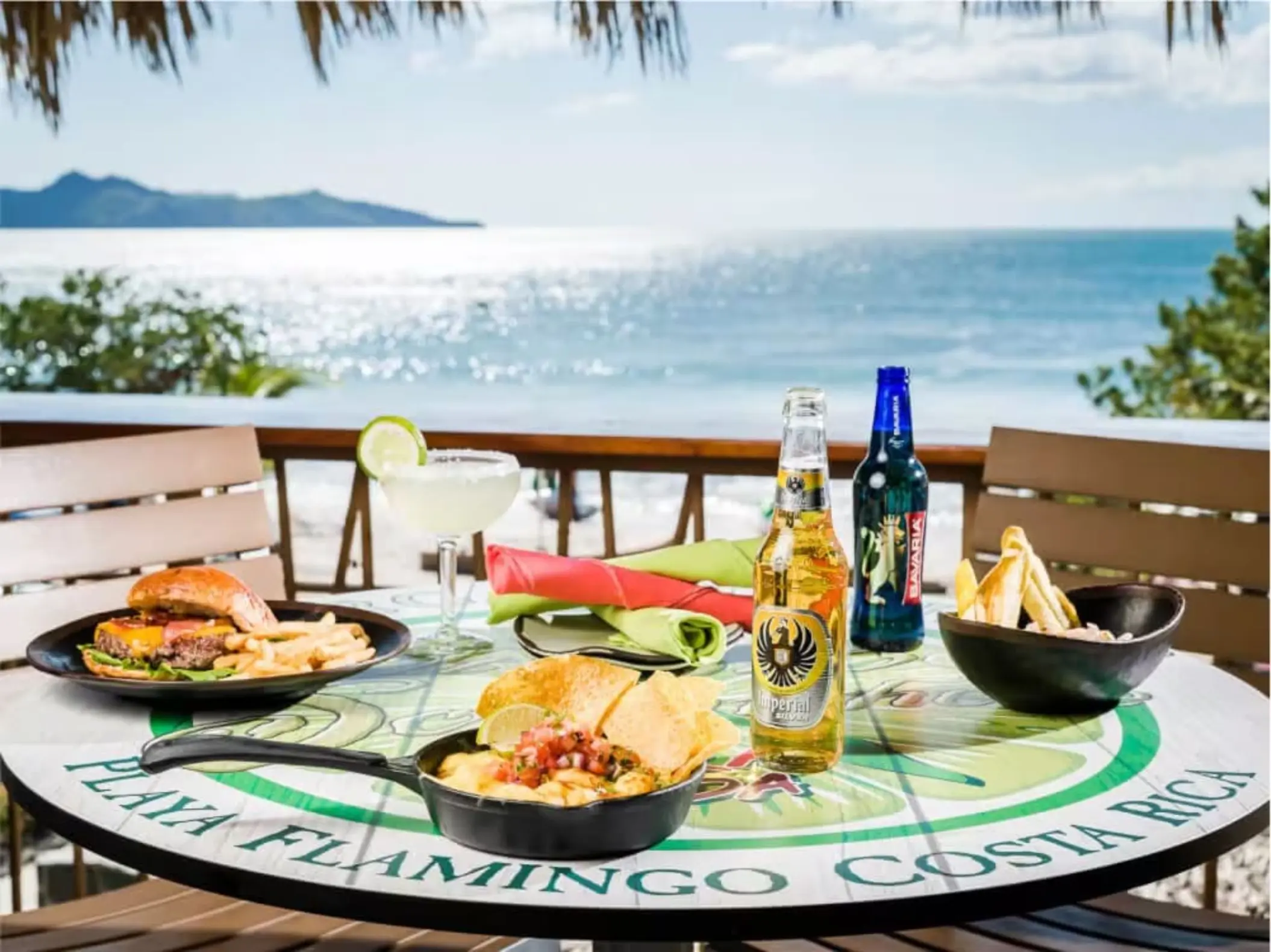 Ocean view dining with burgers, beer, and nachos at Margaritaville Playa Flamingo, Liberia
