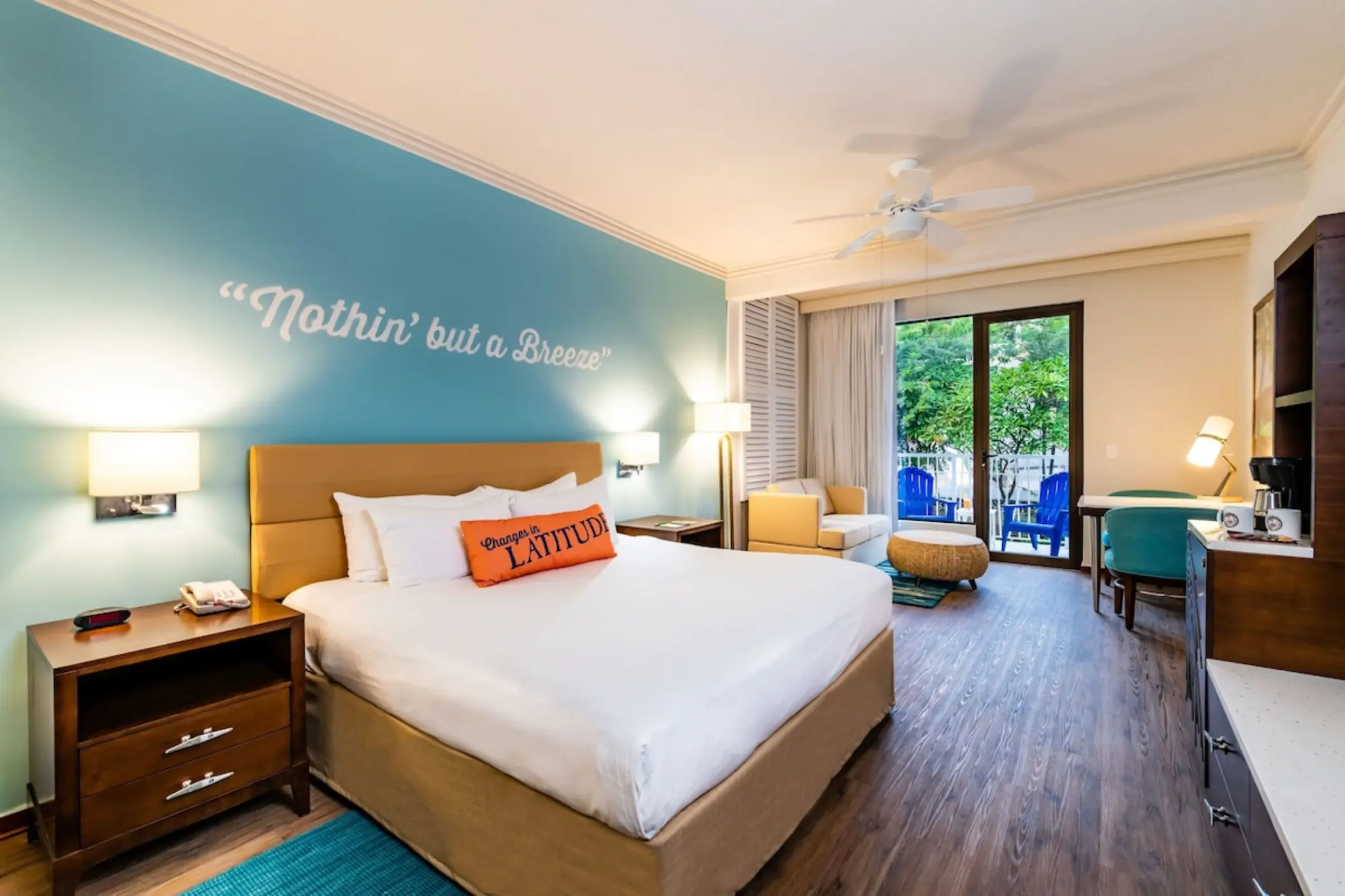 Guest room with garden view and blue accent wall at Margaritaville Beach Resort Playa Flamingo, Liberia