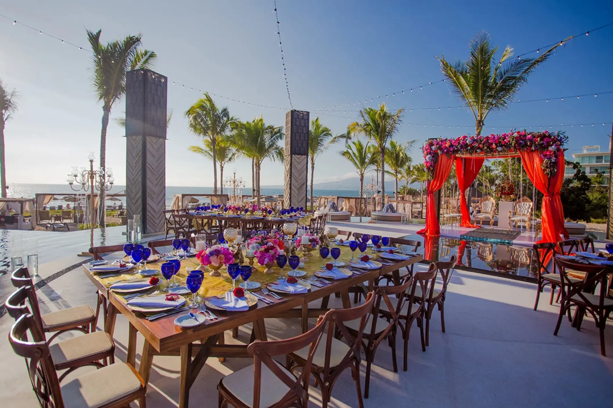 Outdoor wedding reception setup with colorful floral decor at Armony Marival, Puerto Vallarta