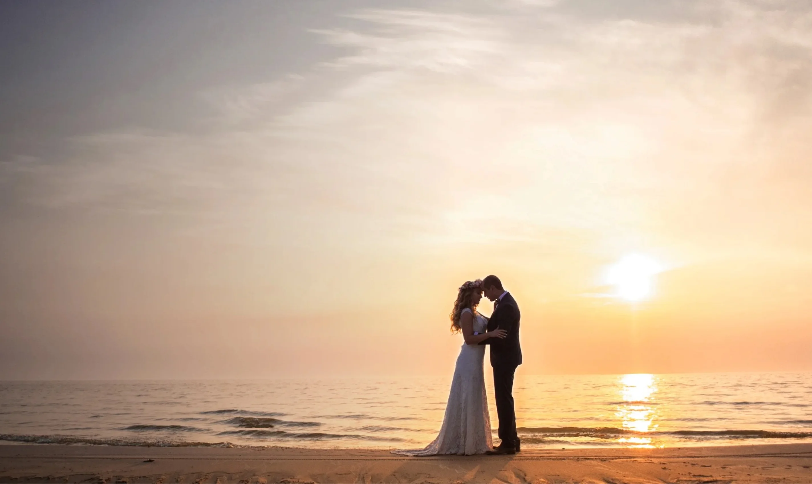 bride and groom on the beach at marival armony punta mita