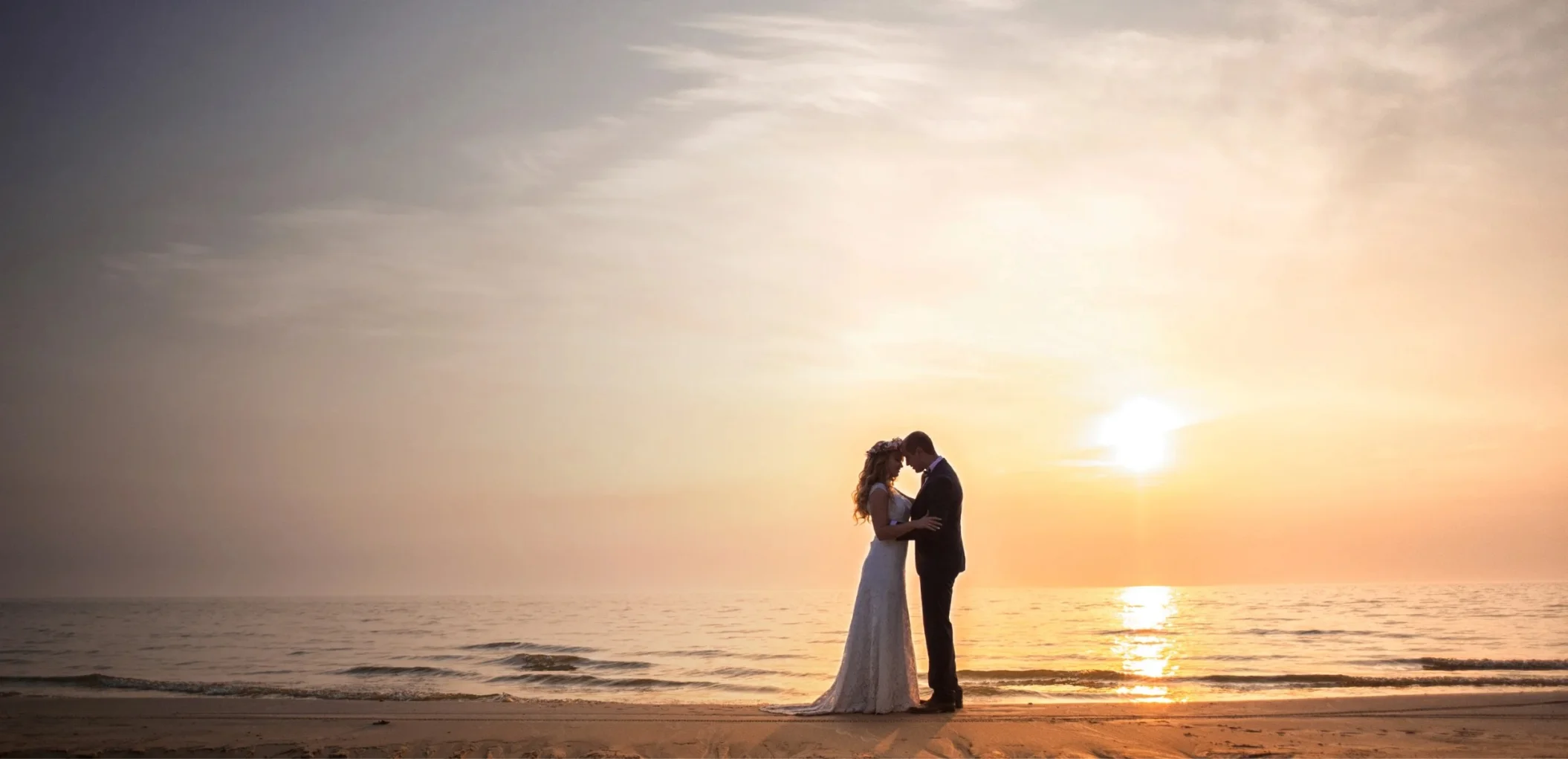 bride and groom on the beach at marival armony punta mita
