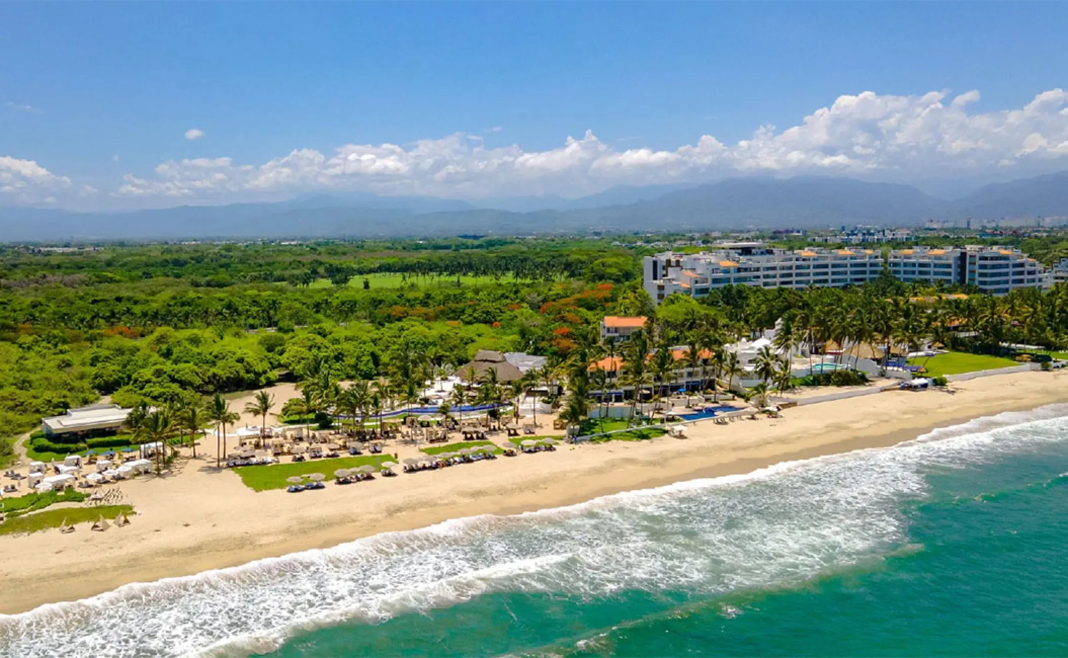 Aerial view of the beachfront Mozzamare Beach Club at Marival Distinct, Puerto Vallarta