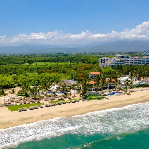 Aerial view of the beachfront Mozzamare Beach Club at Marival Distinct, Puerto Vallarta