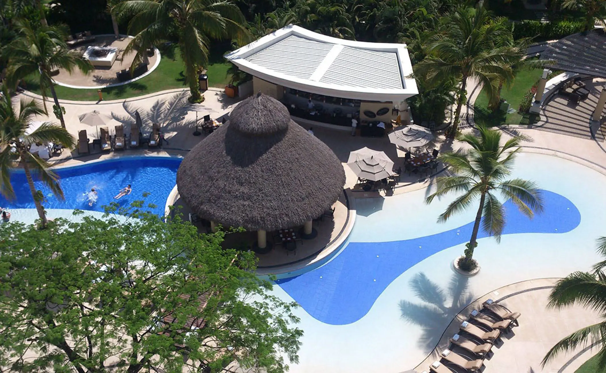 Aerial view of the swimming pool and palapa bar at Marival Distinct, Puerto Vallarta