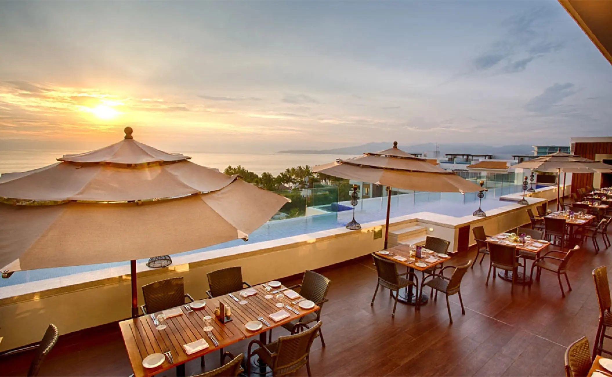 Insu Sky Bar rooftop restaurant at Marival Distinct, Puerto Vallarta overlooking the ocean at sunset