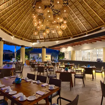 Mozzamare Beach Club restaurant under a palapa roof at Marival Distinct, Puerto Vallarta
