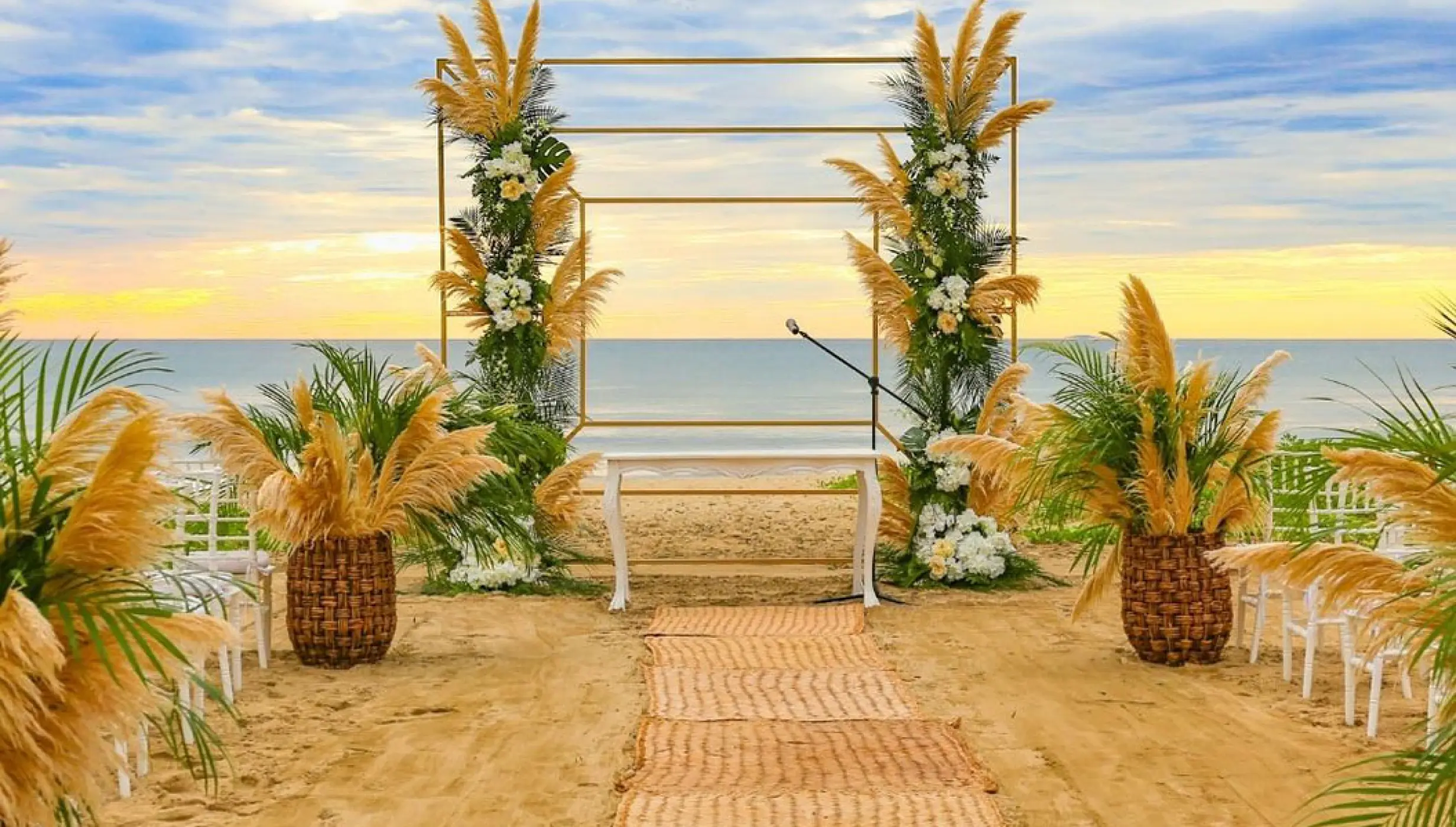 Beach ceremony decor on the beach at Marival Distinct Luxury residences.
