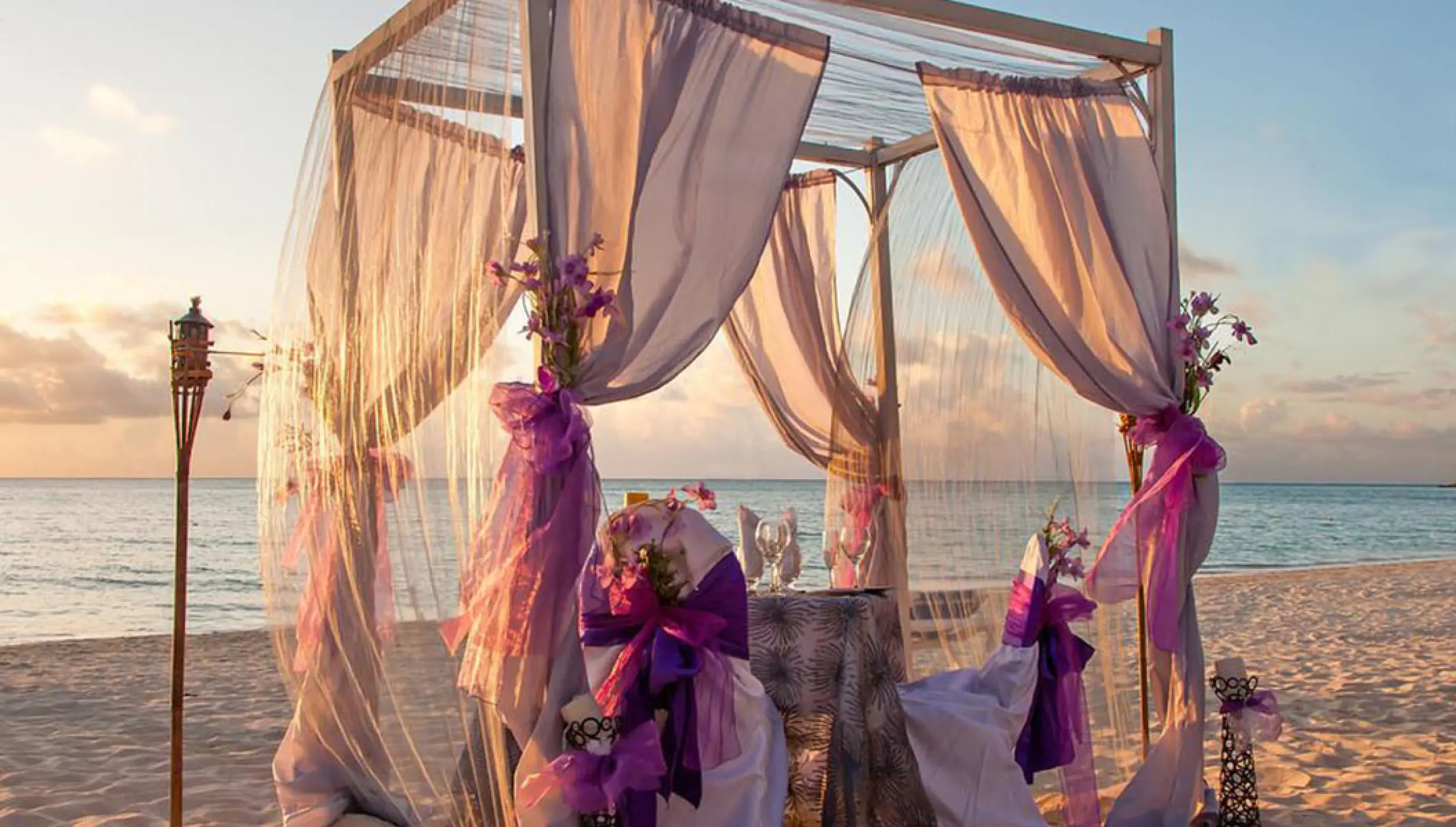 Beach ceremony decor on the beach at Marival Distinct Luxury residences.