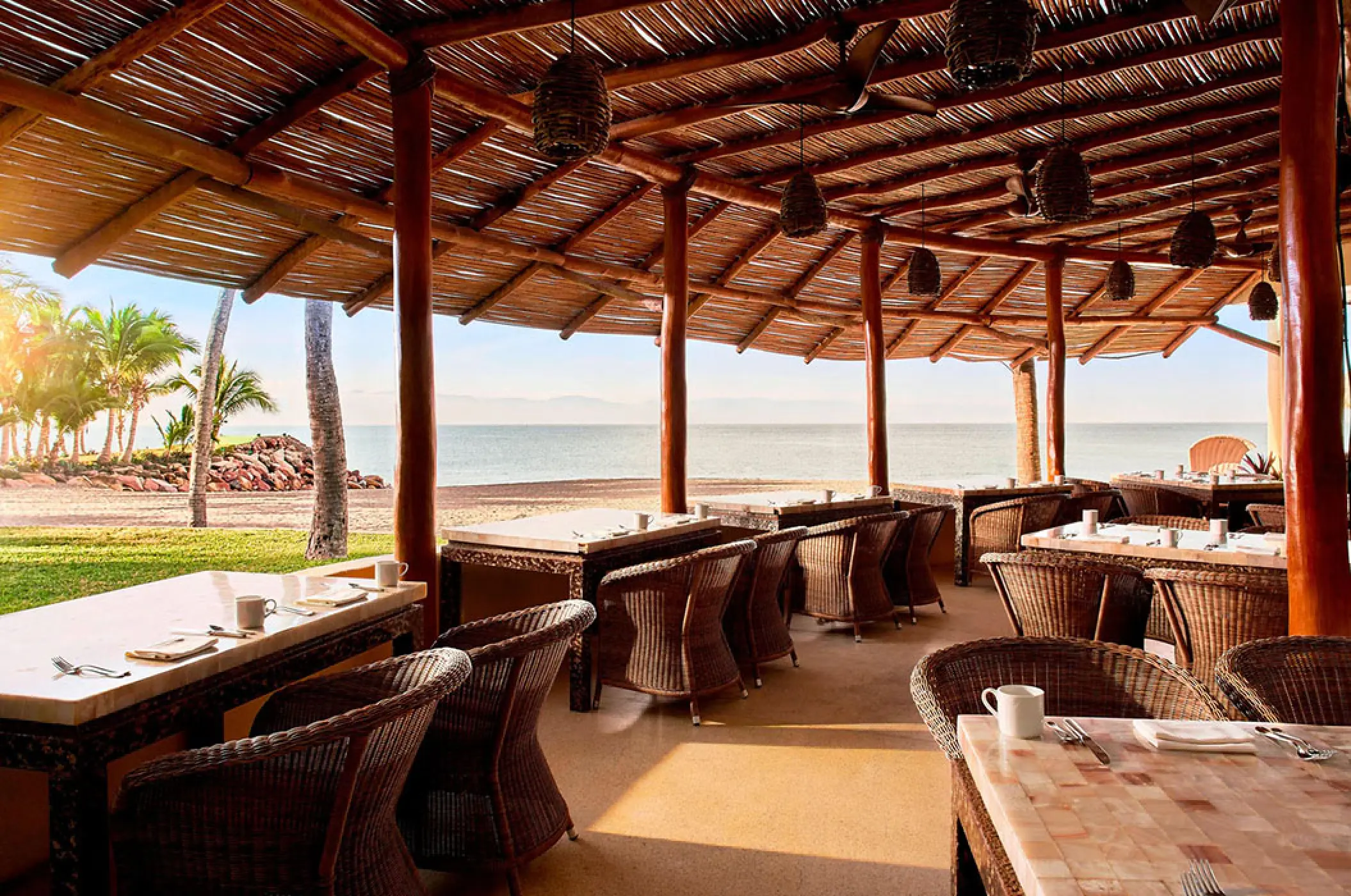 Open-air beachfront restaurant with a thatched roof at Marriott Puerto Vallarta, Puerto Vallarta