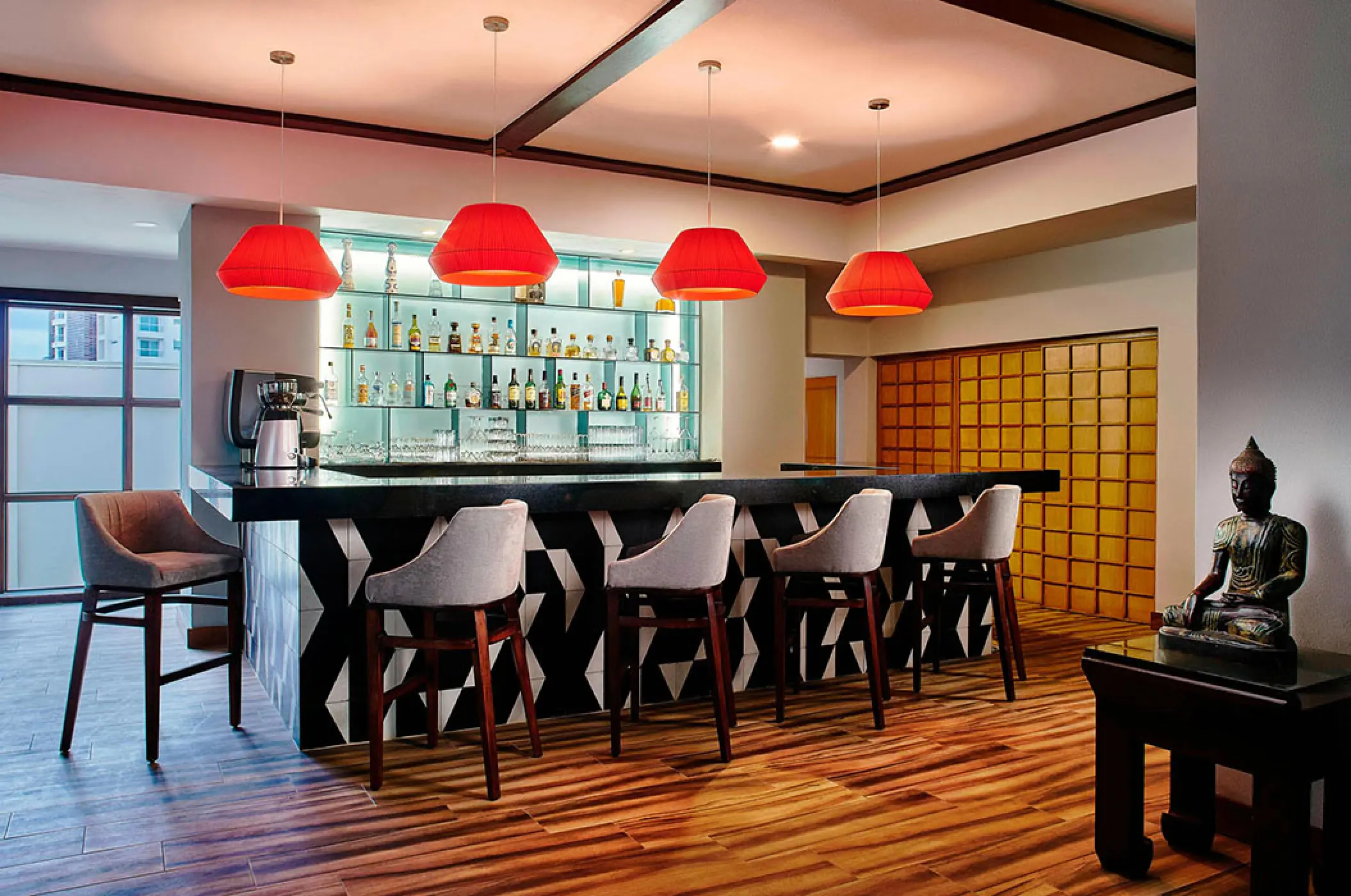 Mikado restaurant bar with red pendant lights and a Buddha statue at Marriott Puerto Vallarta