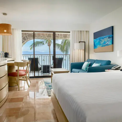 King ocean view room with private balcony and blue accents at Marriott Puerto Vallarta, Puerto Vallarta