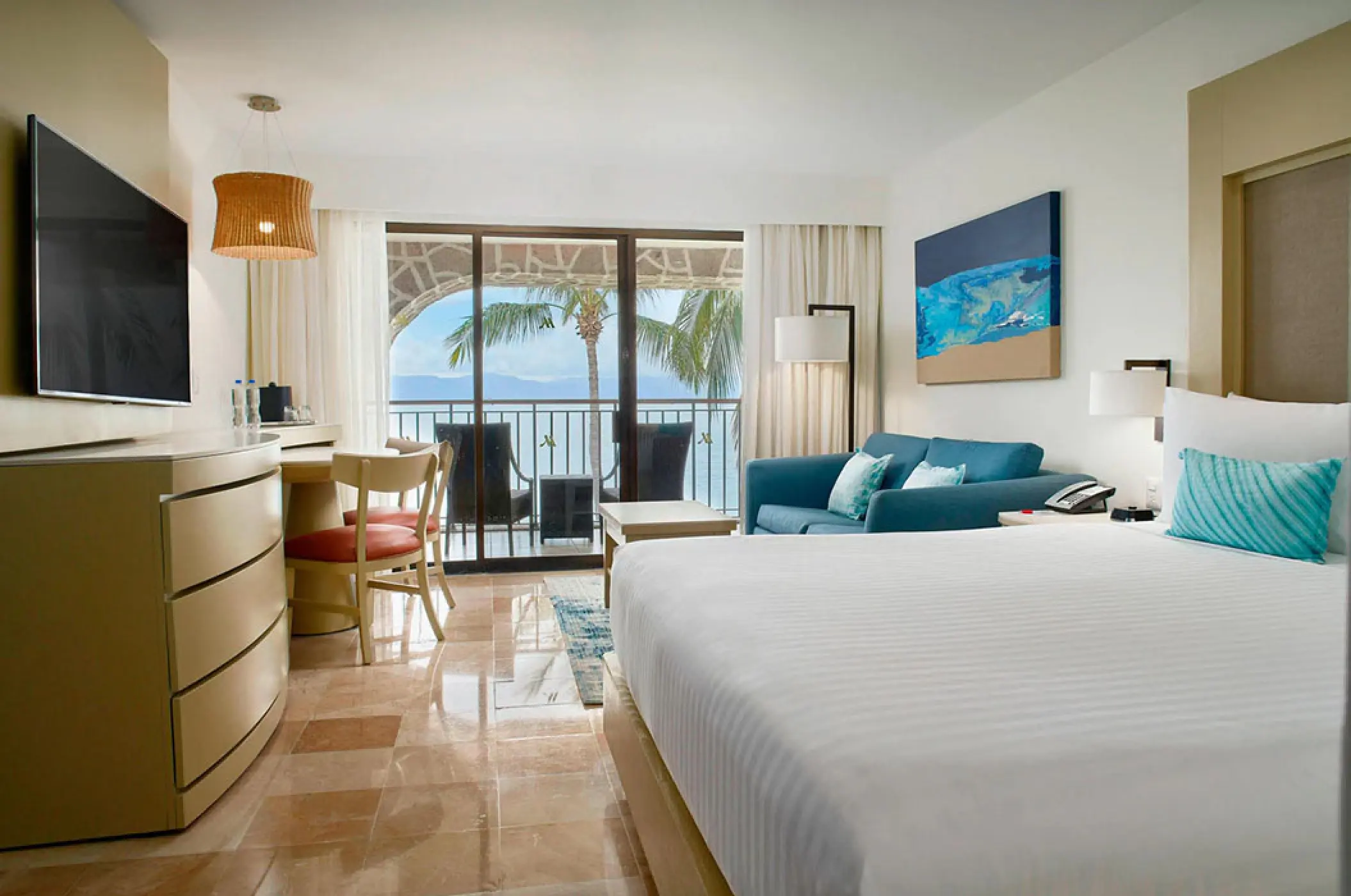 King ocean view room with private balcony and blue accents at Marriott Puerto Vallarta, Puerto Vallarta
