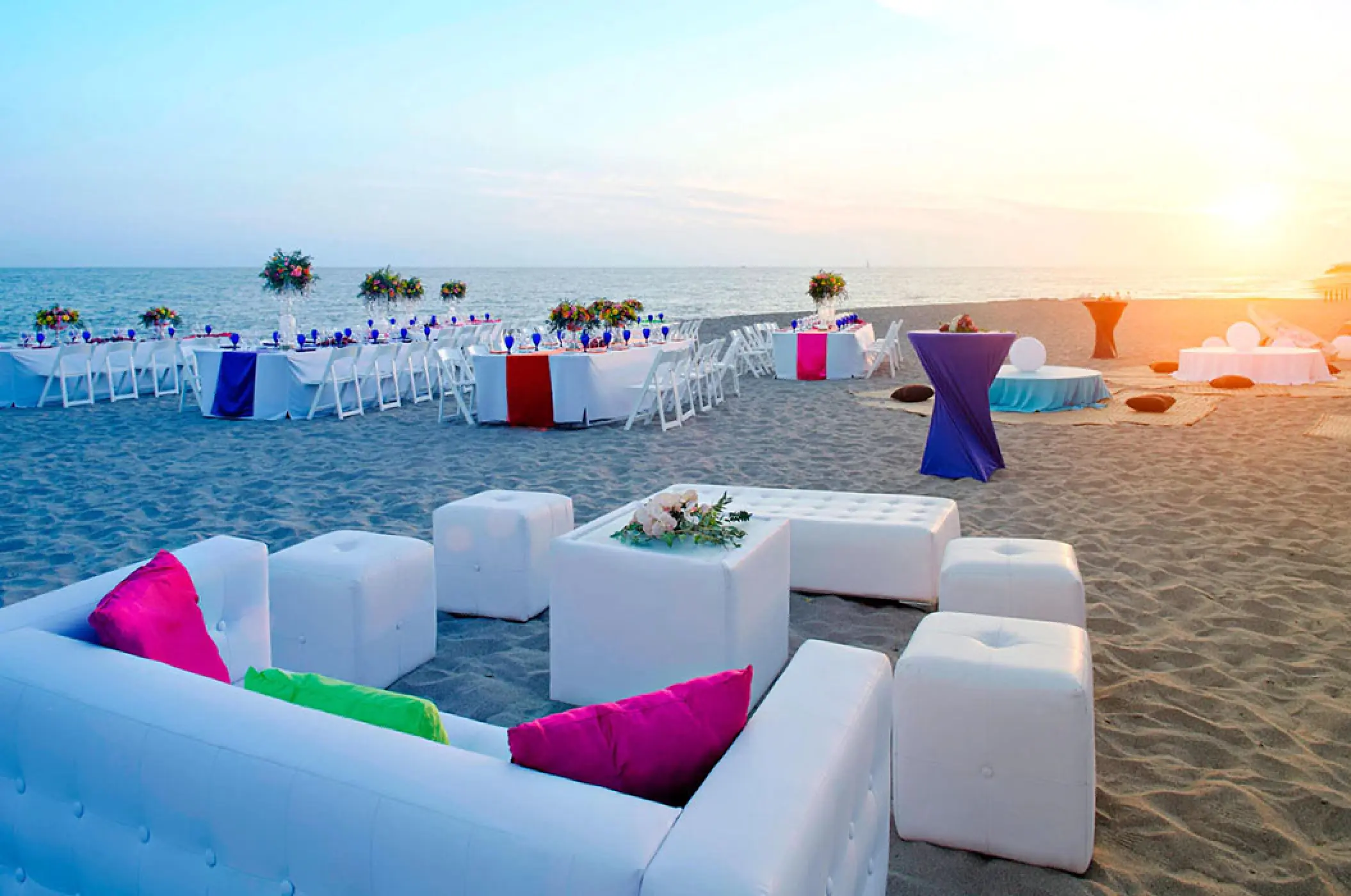 Sunset beach wedding reception with white lounge seating at Marriott Puerto Vallarta, Puerto Vallarta