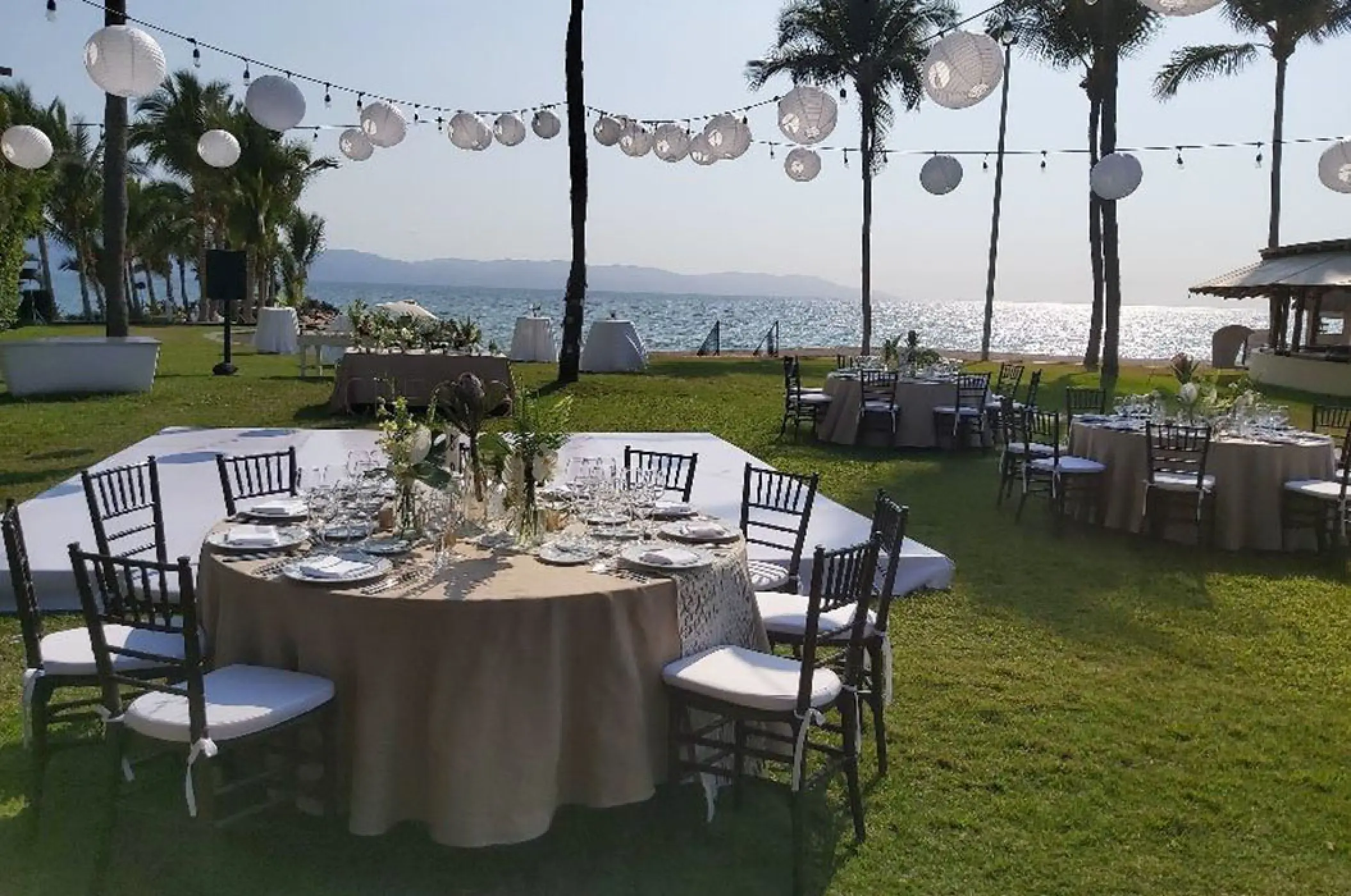 Oceanfront lawn wedding reception setup at Marriott Puerto Vallarta, Puerto Vallarta