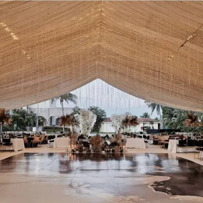 Wedding reception on the main patio under a fairy light canopy at Marriott Puerto Vallarta, Puerto Vallarta