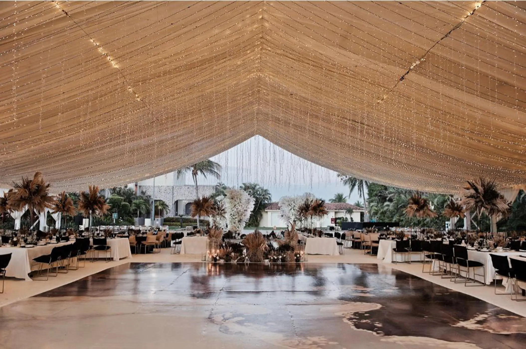 Wedding reception on the main patio under a fairy light canopy at Marriott Puerto Vallarta, Puerto Vallarta