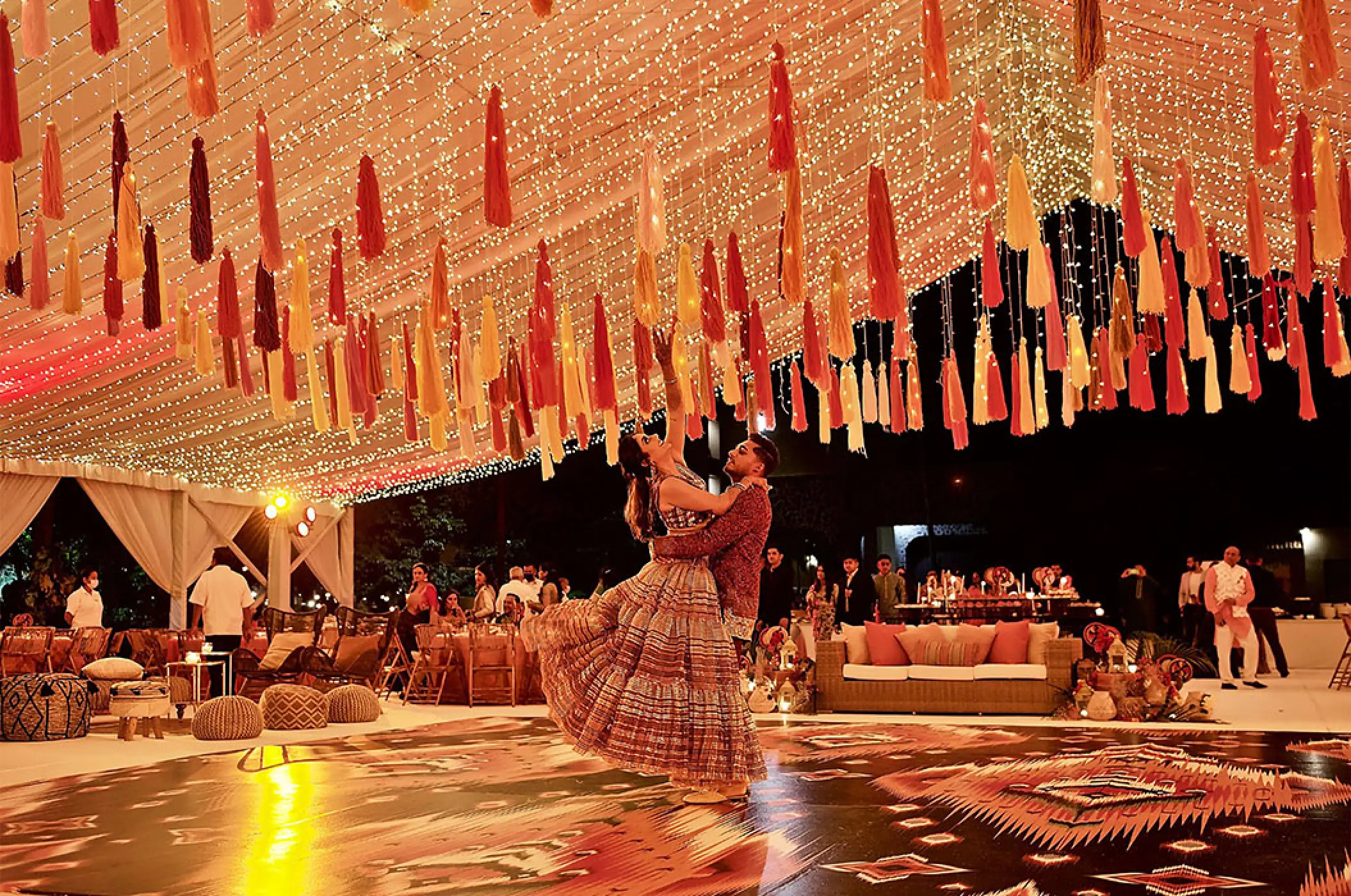 Main patio wedding reception at Marriott Puerto Vallarta under string lights and colorful tassels
